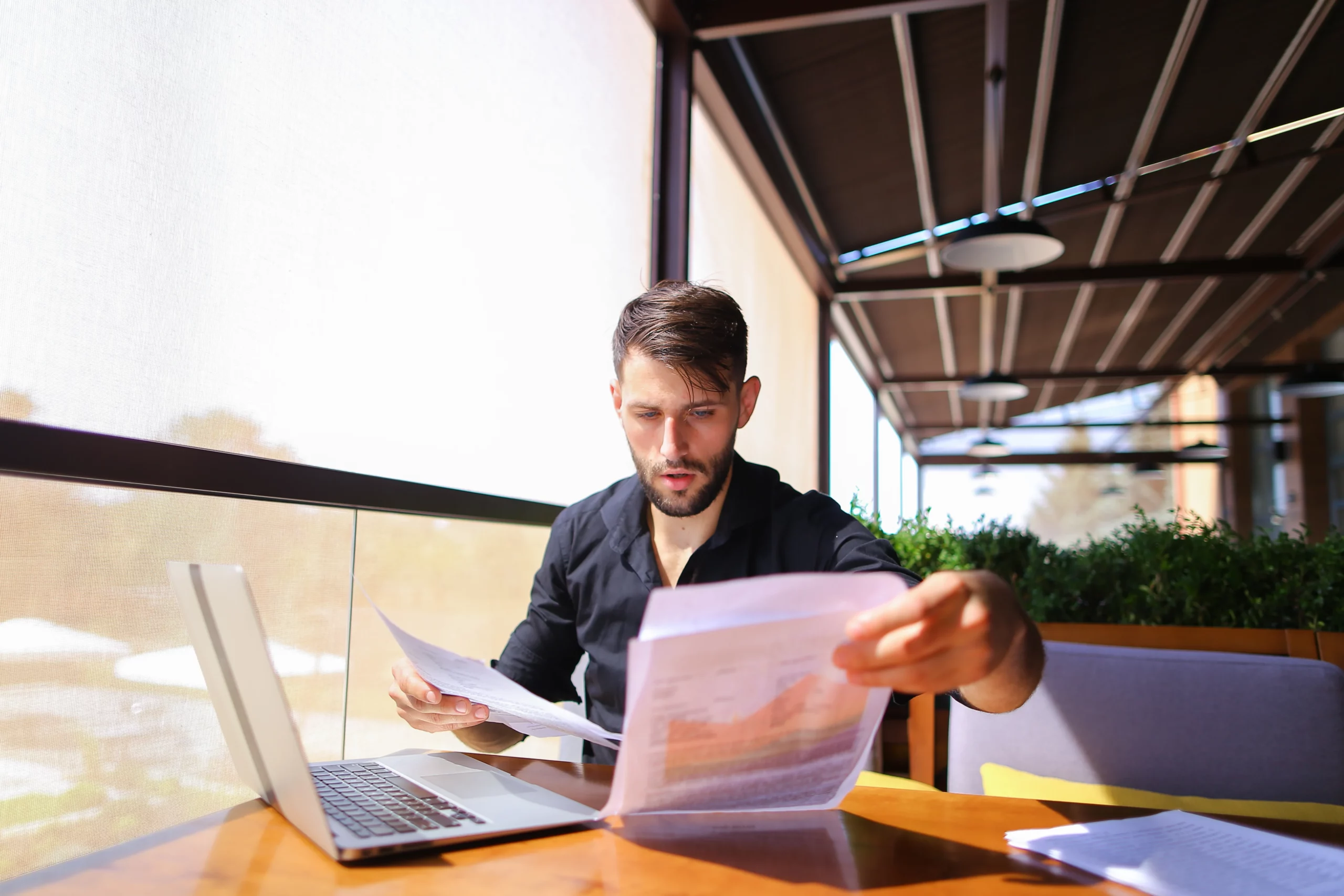 Man sorting legal documents related to creditor claims against trusts in California