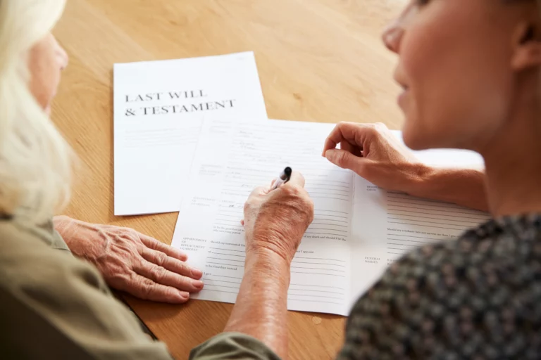 Senior woman reviewing estate planning documents to help prevent forged or fraudulent trust documents in California